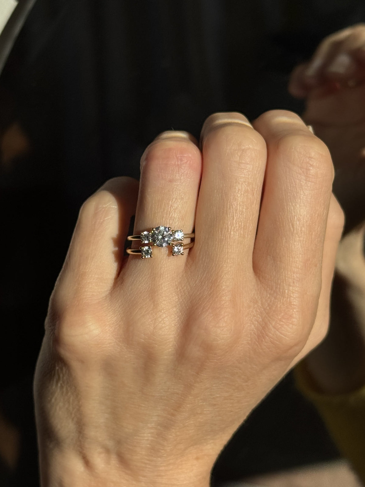 Trilogy Double Brilliant engagement ring set in 18K yellow gold, with a 0.75 carat diamond center stone, flanked by two 0.20 ct diamonds on each side by Nayestones, Belgian fine jewelry.