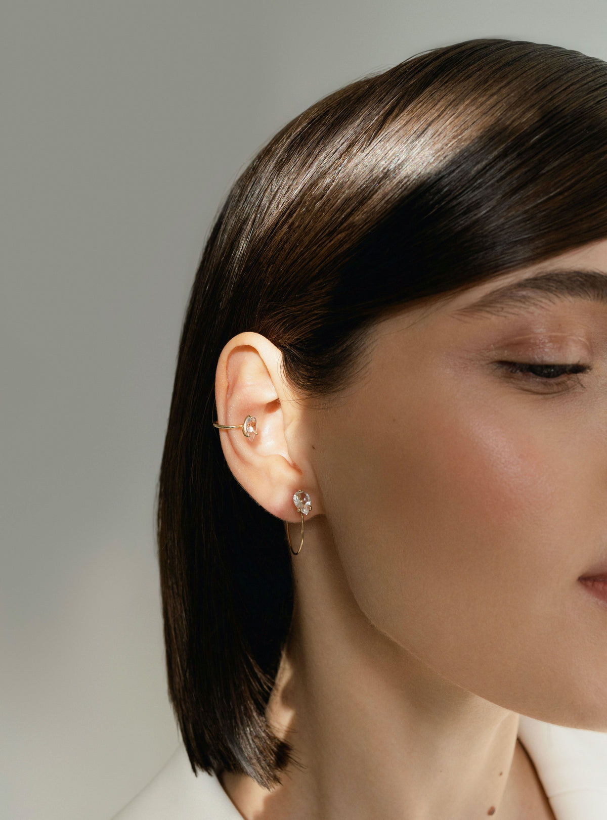 Petite Round Bloom Earrings in 9k yellow gold earrings set with a pear-cut topaz by Nayestones, Blgian fine jewelry.