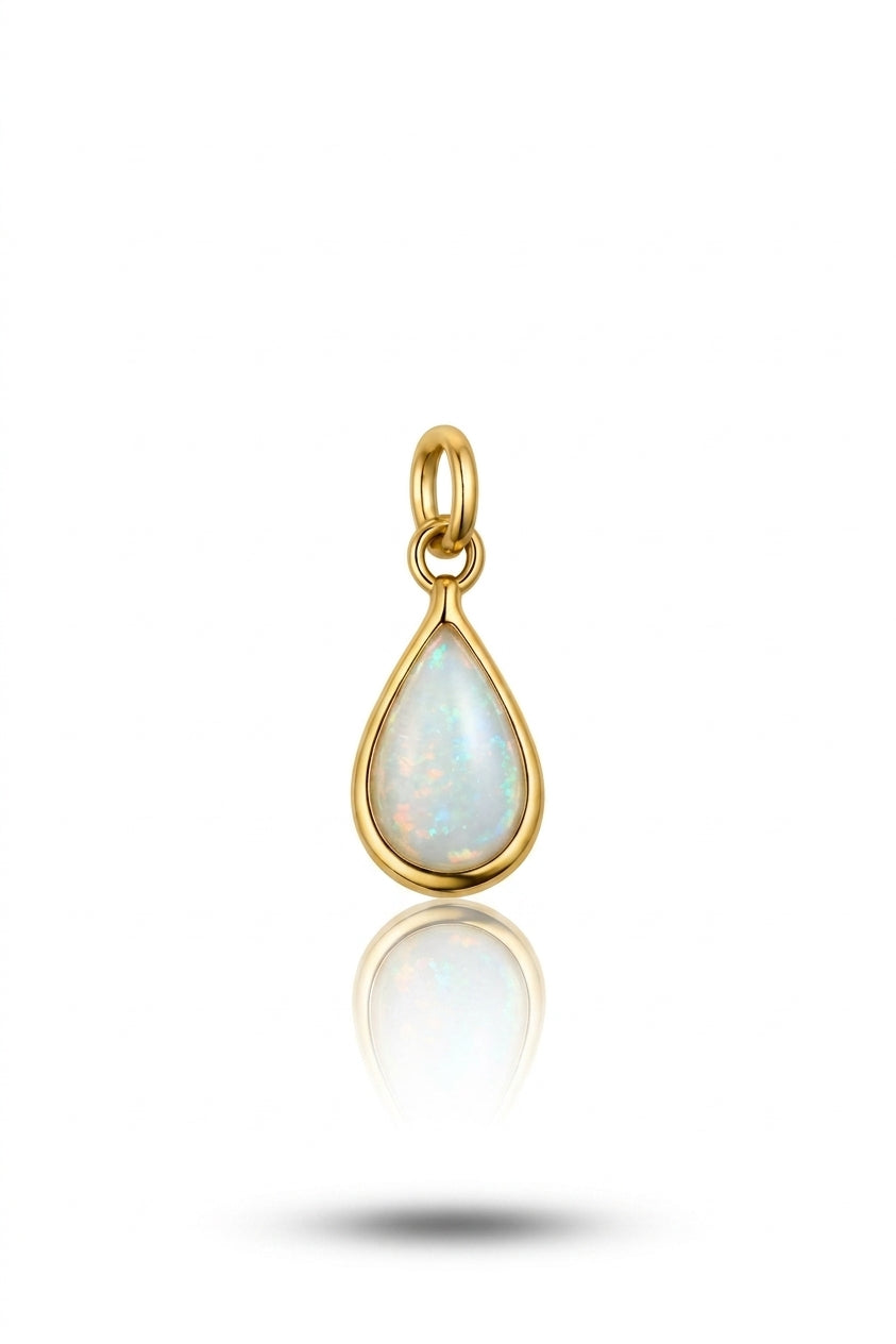 An opal  teardrop pendant held by yellow goldwith iridescent flashes.