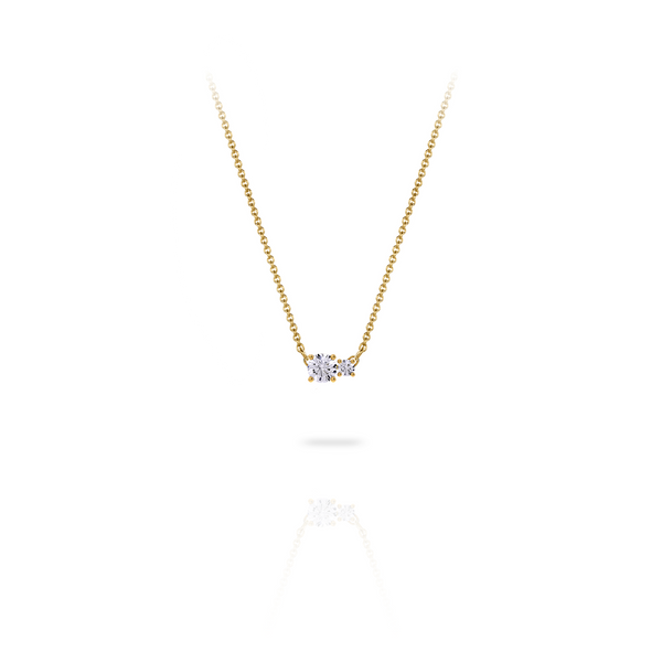 Necklace in 18K yellow gold with a central 0.25-carat diamond and a second smaller one, front view on white background. Elegant, streamlined design from the Essentials collection by Nayestones. Nayestones