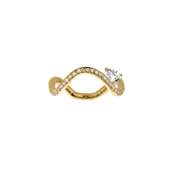 Petite Comete engagement ring in 18k yellow gold ring paved with diamonds and with a 0.5-carat Pear Star Diamond in a white background by Nayestones, Belgian Fine Jewelry. Nayestones