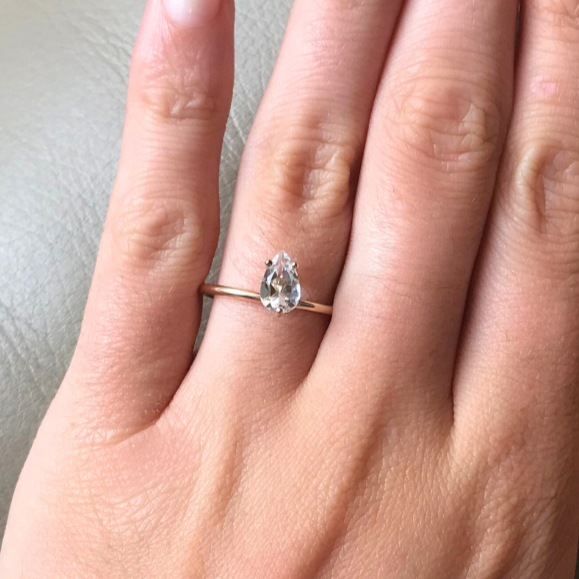 Signature Petite Bloom ring in 9k yellow gold with a center hite topaz stone by Nayestones, Belgian Fine Jewelry.  