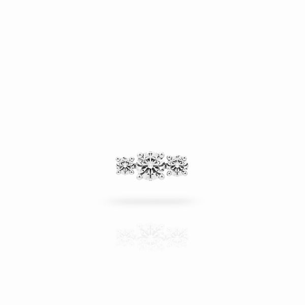 Trilogy earring in 18K white gold with a 0.70-carat center diamond stone and two smaller diamonds on the sides, on a white background. By Nayestones, Belgian fine jewelry brand. Nayestones
