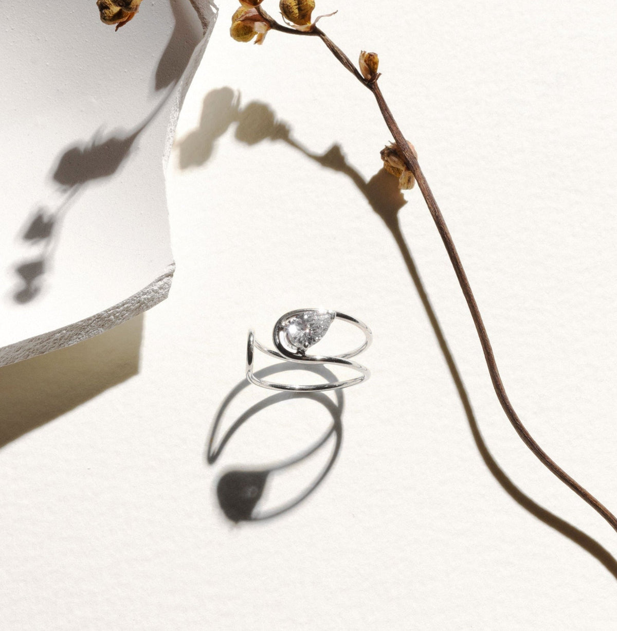 Double C Engagement Ring in 18K White Gold with a Pear Cut Diamond by Nayestones, Belgian Fine Jewelry. 