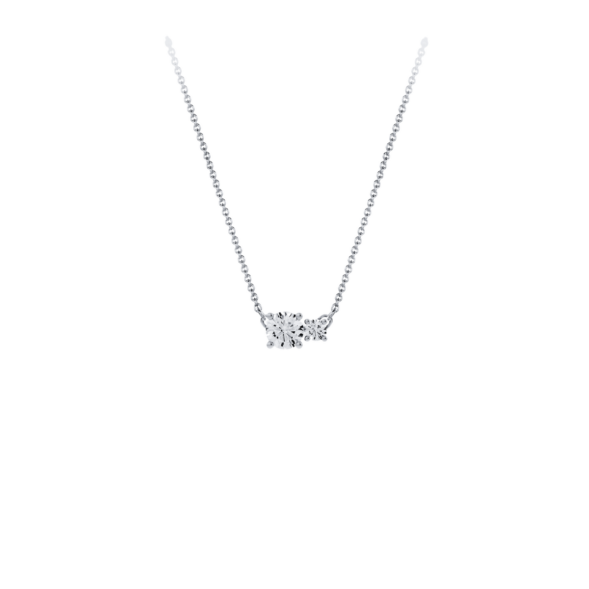 Necklace in 18K white gold with a central 0.70-carat diamond and a second smaller one, front view on white background. Elegant, streamlined design from the Essentials collection by Nayestones.