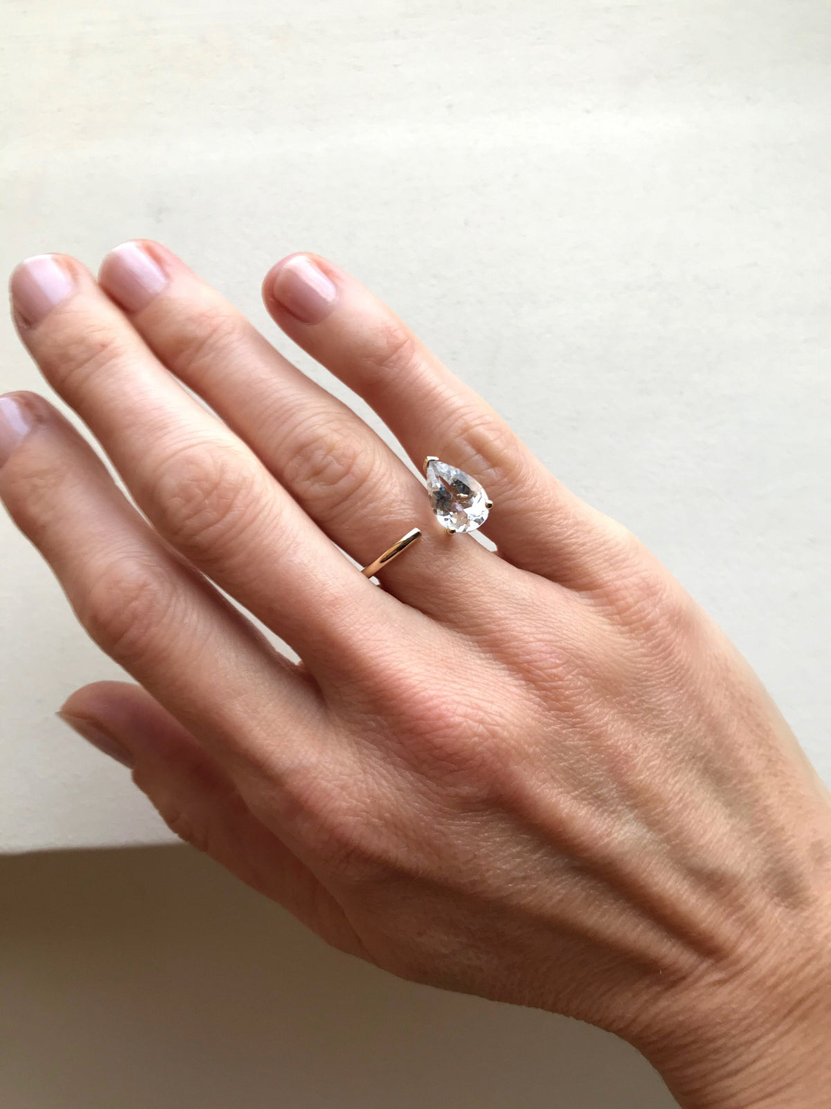  Bloom Ring in 9k yellow gold ring with a pear-cut white topaz stone by Nayestones, Belgian fine jewelry. 