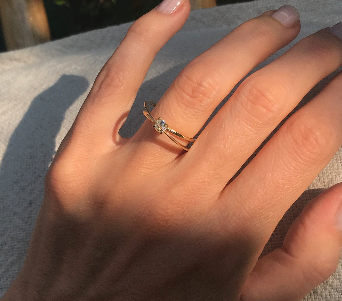 Moon Ellipse engagement solitaire ring in 18k yellow gold with a 0.25 carats diamond by Nayestones, Belgian fine jewelry. 