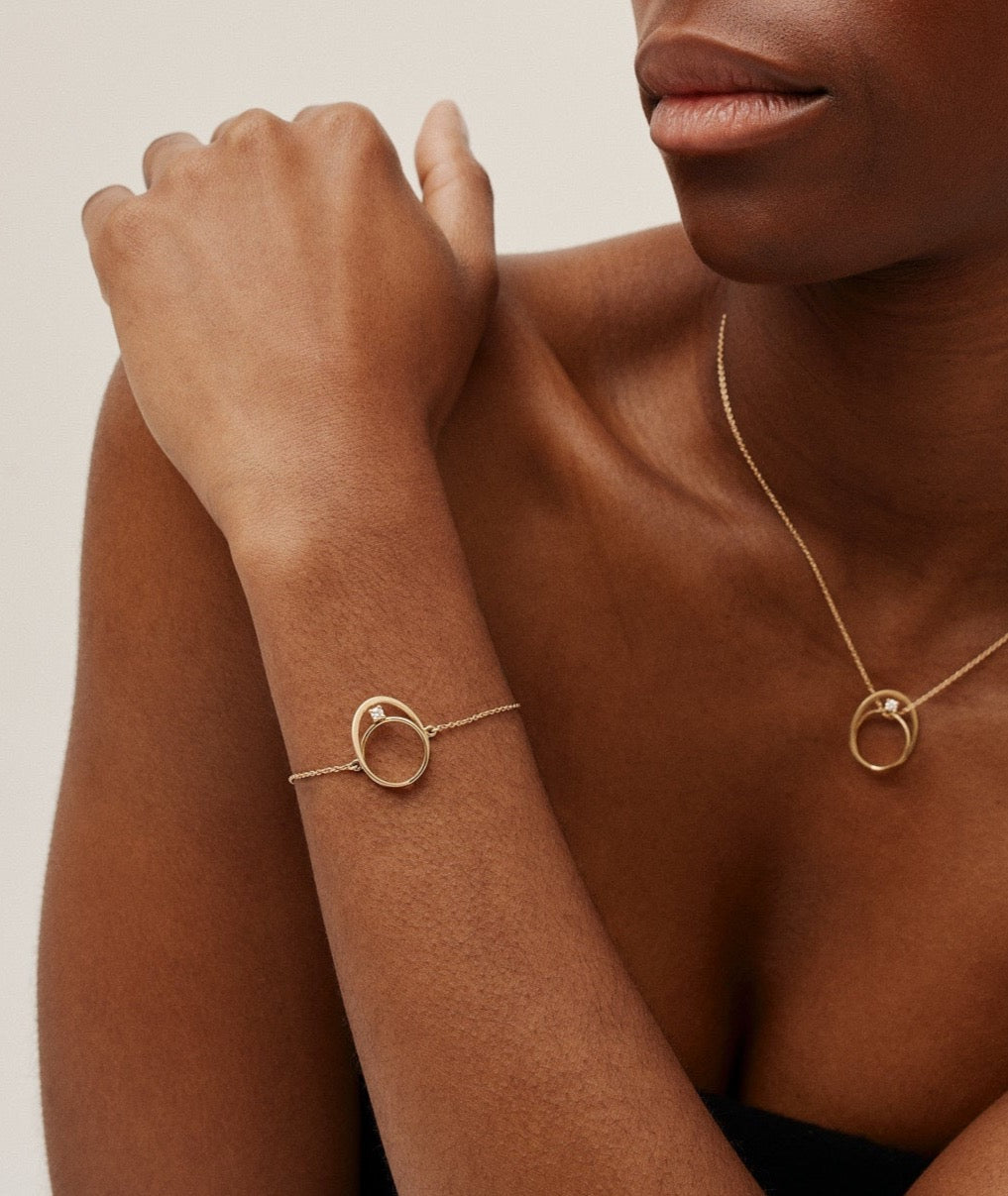 Moon Ellipse bracelet in 18K yellow gold with 0.05 carats diamond by  Nayestones, Belgian fine jewelry. 