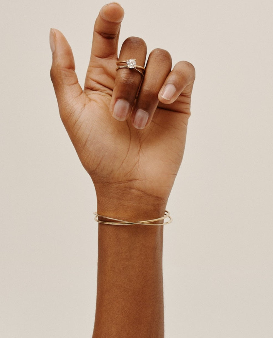 Moon Ellipse 18K gold open bracelet: inspired by the moon, a versatile piece perfect for any outfit, pairs beautifully with matching collection items. Made in Antwerp