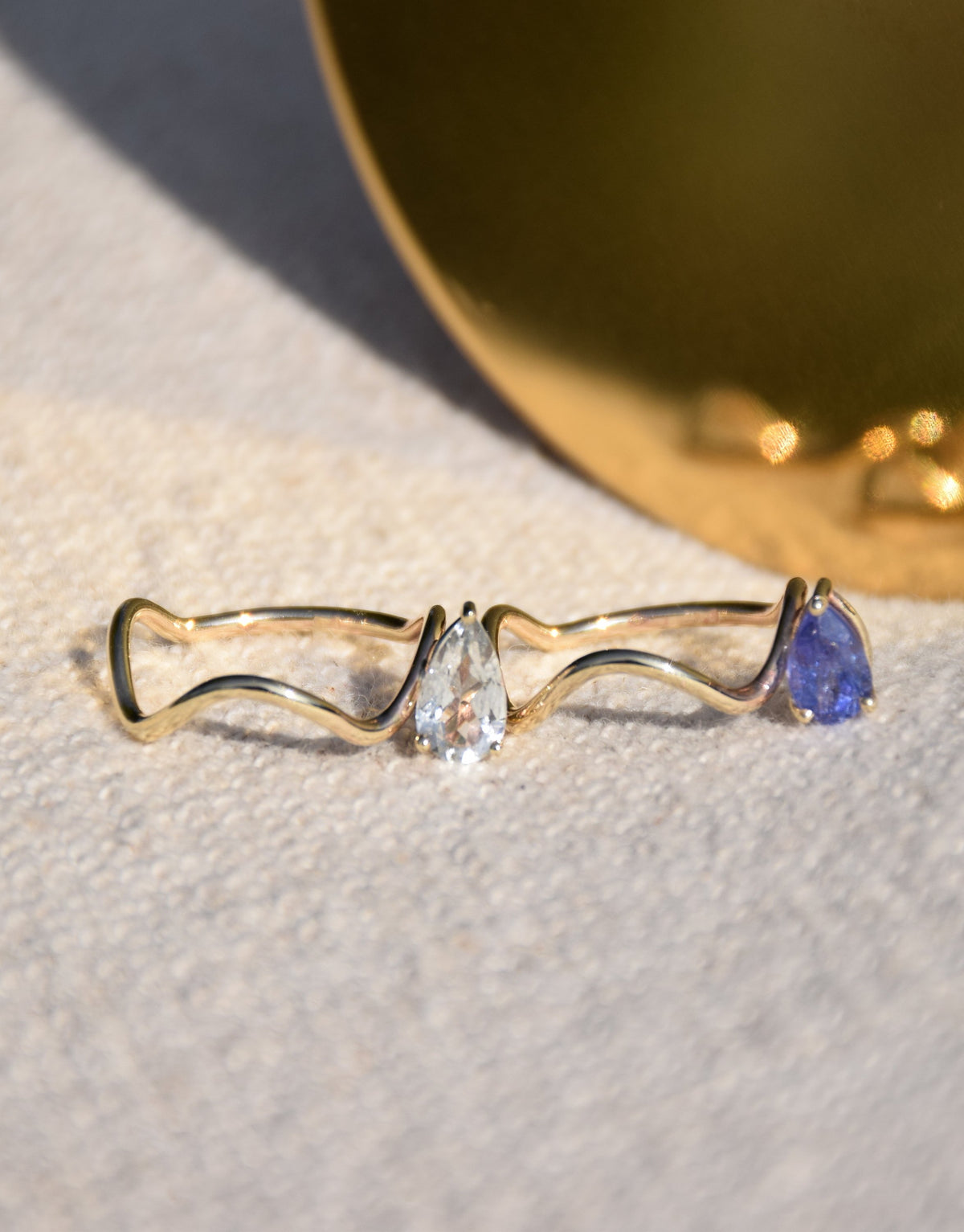 Nayestones Fine Jewelry newest ring in Blue Tanzanite and yellow gold 9k wave ring