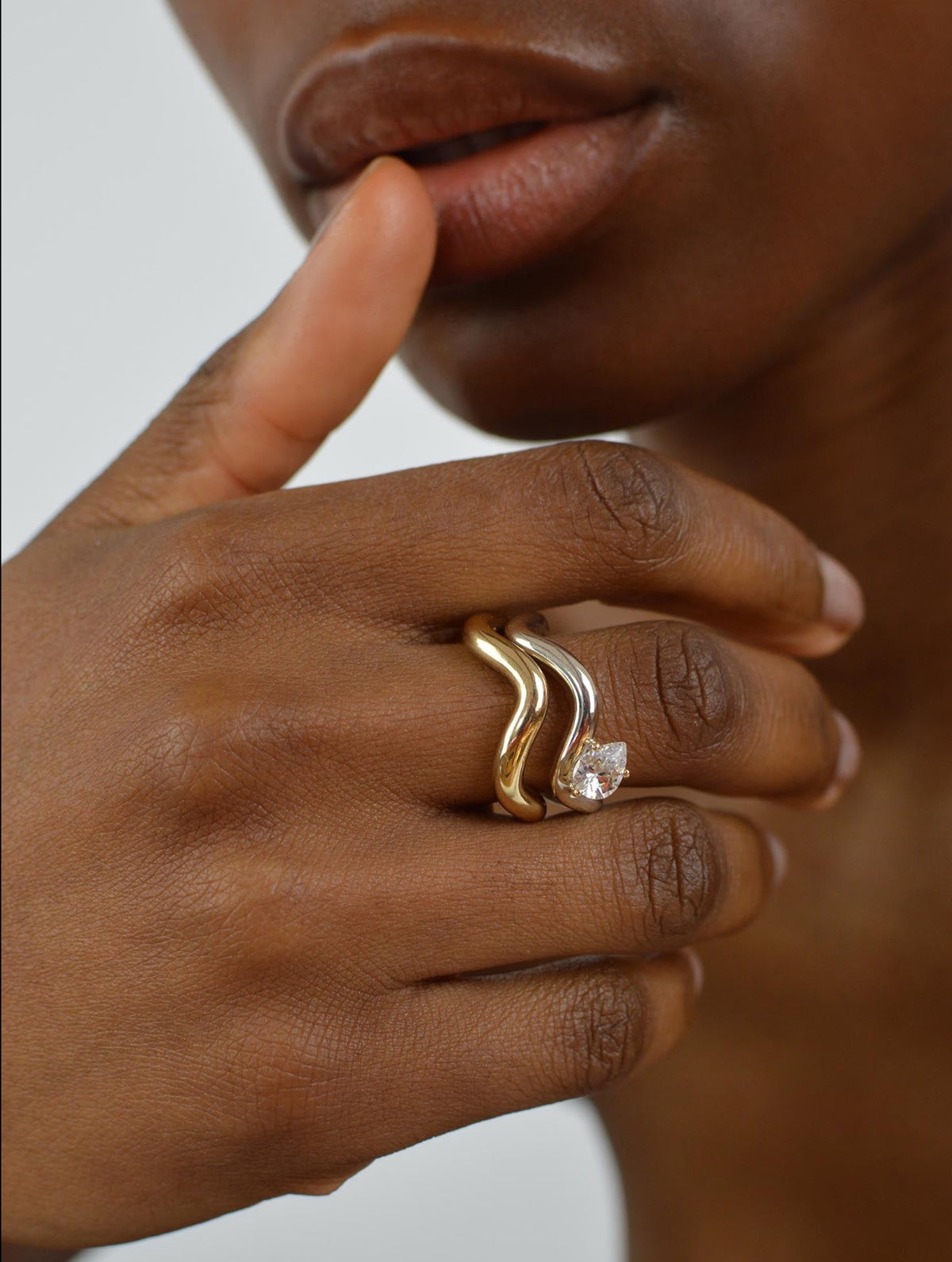 Petite Comète chunky ring in 925 silver with a pear-cut cubic zirconia stacked with petite comete chunky gold vermeil ring by Nayestones, Belgian fine jewelry